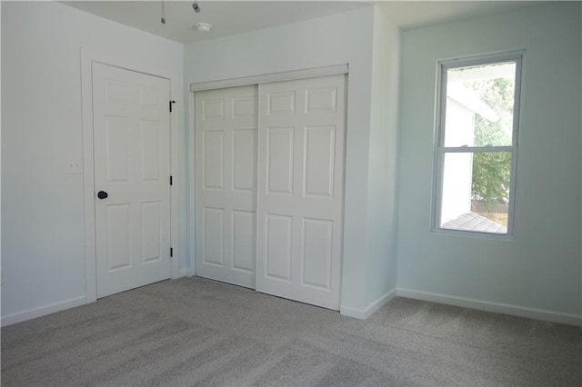 5032 E 8th St, Kansas City, MO 64124 - unfurnished bedroom with carpet flooring and a closet