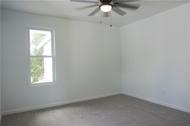 5032 E 8th St, Kansas City, MO 64124 - carpeted spare room featuring ceiling fan and healthy amount of natural light