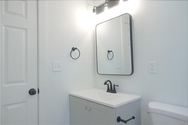 5032 E 8th St, Kansas City, MO 64124 - half bathroom with vanity and toilet