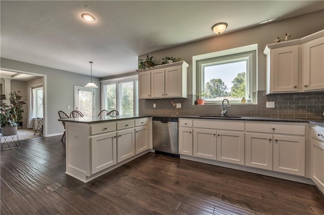23317 W 52nd Ter, Shawnee, KS 66226 - kitchen featuring stainless steel dishwasher, a peninsula, white cabinetry, tasteful backsplash, and recessed lighting