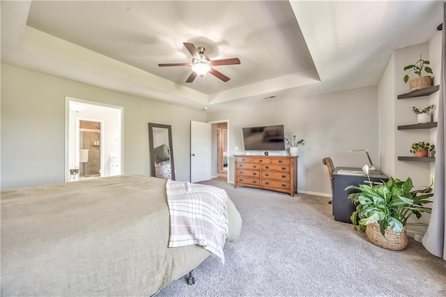 23317 W 52nd Ter, Shawnee, KS 66226 - bedroom featuring a tray ceiling, carpet flooring, a ceiling fan, and connected bathroom
