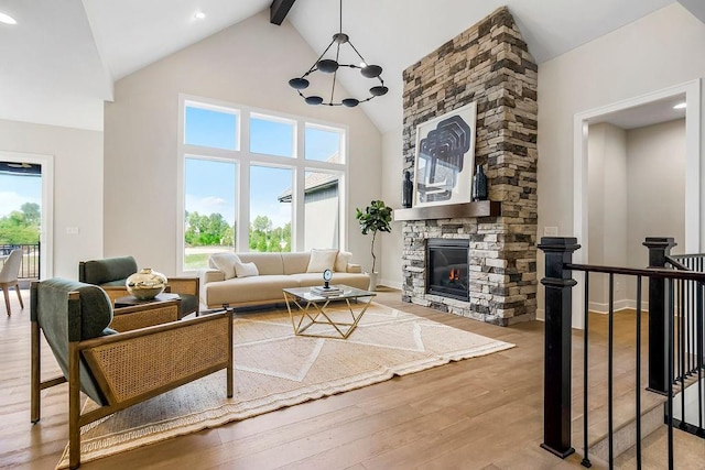 16567 W 170th St, Olathe, KS 66062 - living area featuring high vaulted ceiling, hardwood / wood-style flooring, beamed ceiling, healthy amount of natural light, and a stone fireplace