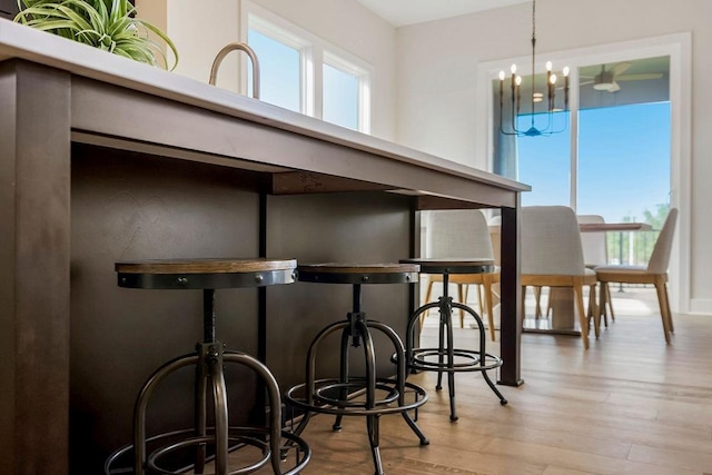 16567 W 170th St, Olathe, KS 66062 - dining area featuring wood finished floors and a chandelier