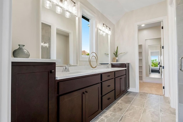 16567 W 170th St, Olathe, KS 66062 - full bath featuring double vanity, a walk in closet, a shower, tile patterned floors, and lofted ceiling