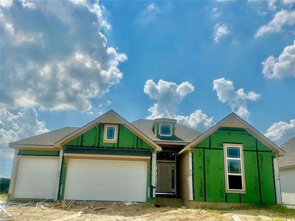 7040 NW Forest Lakes Dr, Parkville, MO 64152 - property under construction featuring a garage and a shingled roof