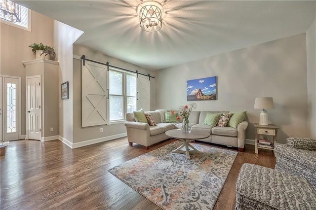 11508 Hauser St, Overland Park, KS 66210 - living area featuring a barn door and wood finished floors