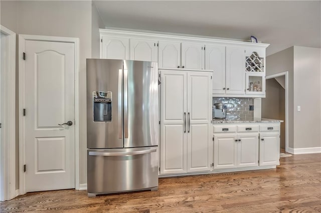 11508 Hauser St, Overland Park, KS 66210 - kitchen with stainless steel refrigerator with ice dispenser, white cabinets, and light wood-type flooring