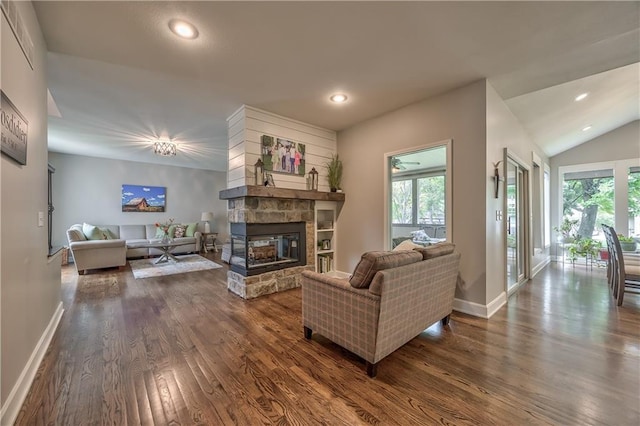 11508 Hauser St, Overland Park, KS 66210 - living room featuring dark wood-style floors, plenty of natural light, a fireplace, recessed lighting, and lofted ceiling