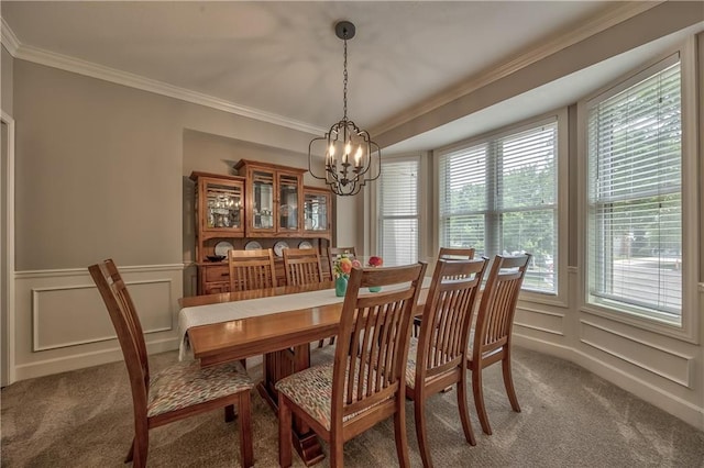 11508 Hauser St, Overland Park, KS 66210 - dining room featuring light colored carpet, a chandelier, crown molding, a decorative wall, and a wainscoted wall