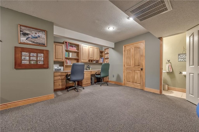 11508 Hauser St, Overland Park, KS 66210 - office space with light colored carpet, a textured ceiling, and built in desk