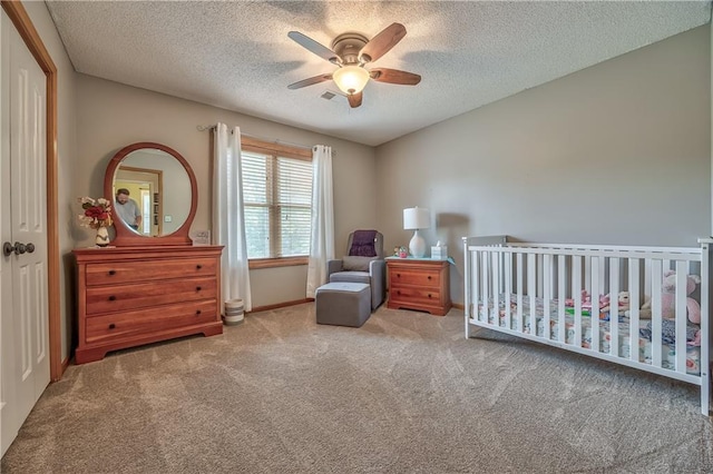 11508 Hauser St, Overland Park, KS 66210 - carpeted bedroom with a textured ceiling, a nursery area, and a ceiling fan