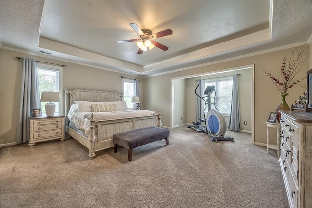 11508 Hauser St, Overland Park, KS 66210 - carpeted bedroom with a raised ceiling, multiple windows, ornamental molding, and a ceiling fan