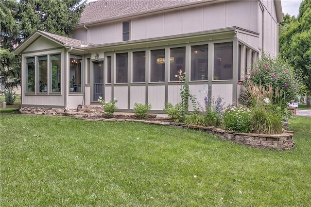 11508 Hauser St, Overland Park, KS 66210 - back of house with a sunroom and a yard