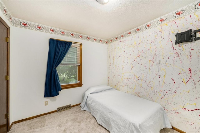 7608 N Serene Ave, Kansas City, MO 64152 - bedroom with carpet floors and a textured ceiling
