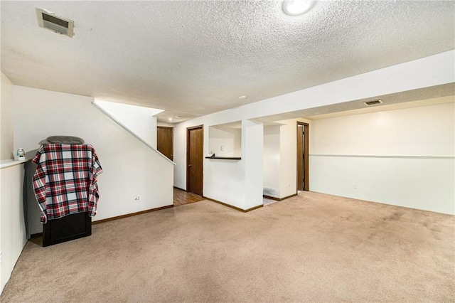 7608 N Serene Ave, Kansas City, MO 64152 - finished basement with carpet floors and a textured ceiling