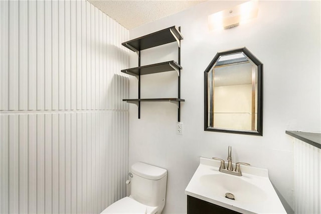 7608 N Serene Ave, Kansas City, MO 64152 - bathroom featuring vanity and a textured ceiling