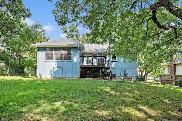 7608 N Serene Ave, Kansas City, MO 64152 - back of property with stairway, a wooden deck, a fenced backyard, and board and batten siding