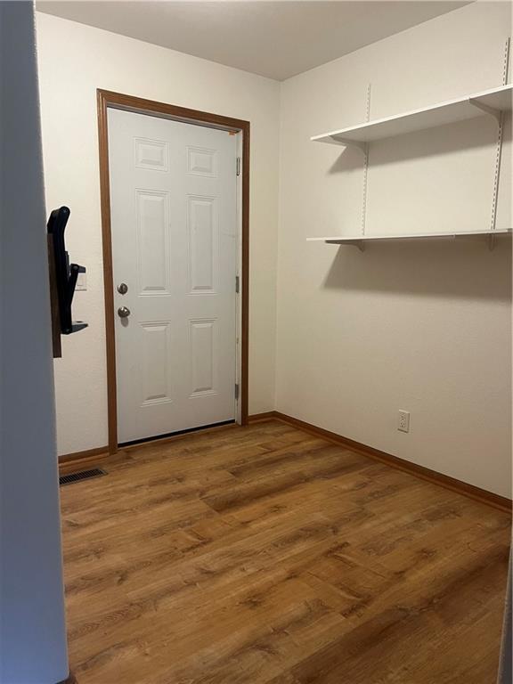 36987 W 63rd St, Camden, MO 64017 - interior space with baseboards and light wood finished floors