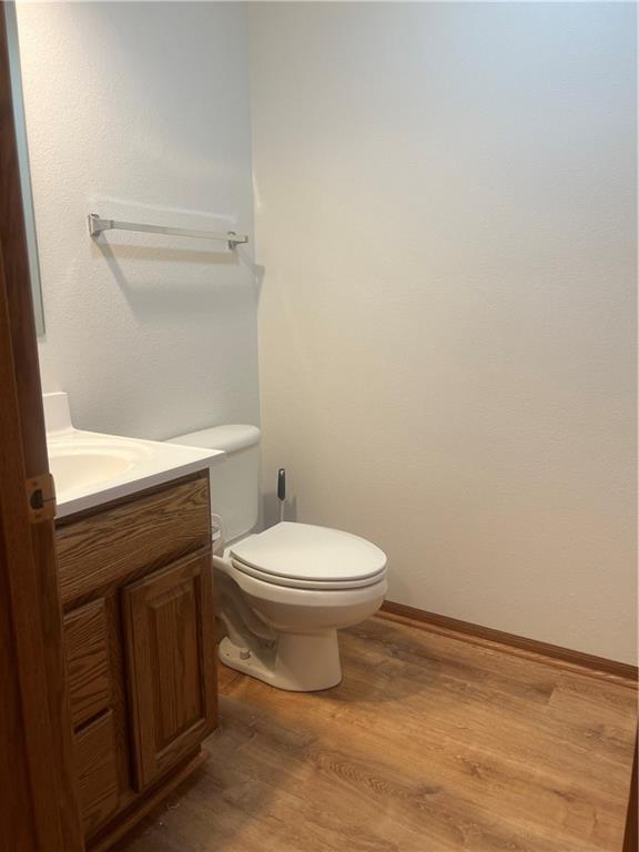 36987 W 63rd St, Camden, MO 64017 - half bathroom with vanity and wood finished floors
