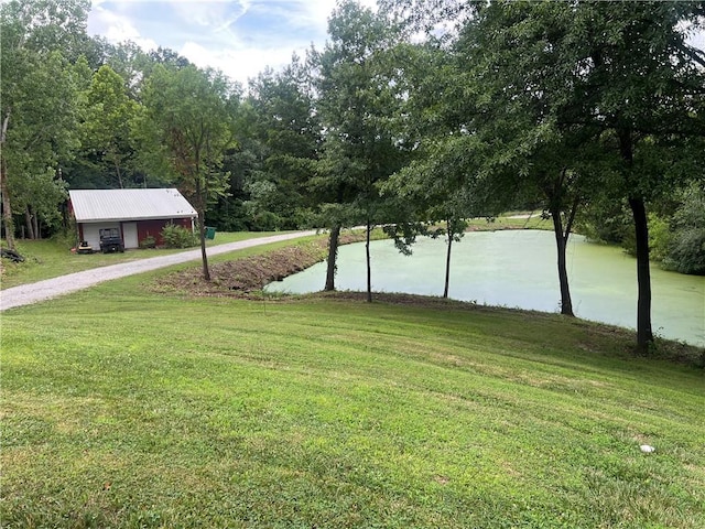 36987 W 63rd St, Camden, MO 64017 - view of green lawn featuring a water view and gravel driveway
