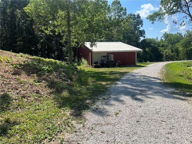 36987 W 63rd St, Camden, MO 64017 - view of side of property featuring an outbuilding and driveway