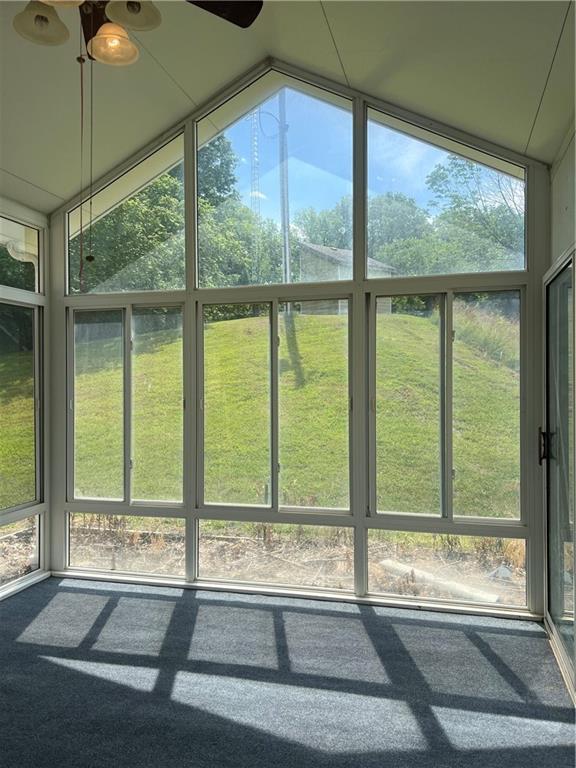 36987 W 63rd St, Camden, MO 64017 - unfurnished sunroom with ceiling fan and vaulted ceiling