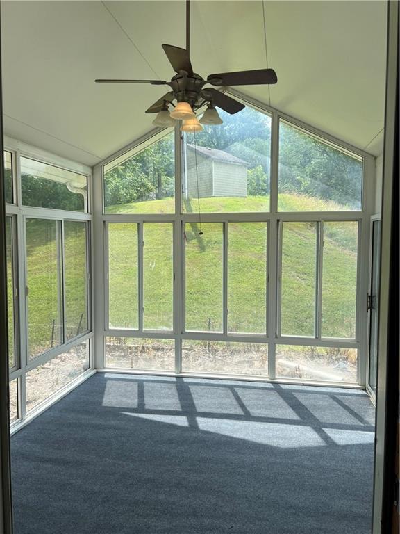 36987 W 63rd St, Camden, MO 64017 - unfurnished sunroom with a ceiling fan and vaulted ceiling