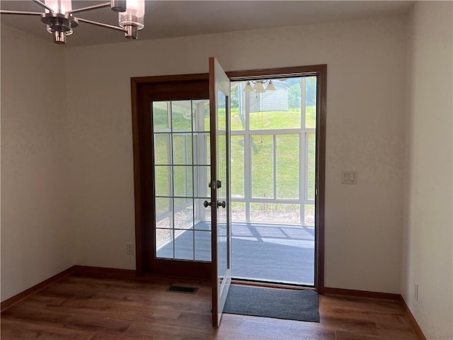 36987 W 63rd St, Camden, MO 64017 - doorway with wood finished floors, french doors, and a chandelier