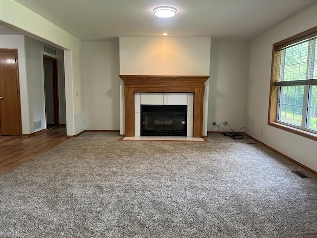 36987 W 63rd St, Camden, MO 64017 - unfurnished living room featuring carpet and a fireplace