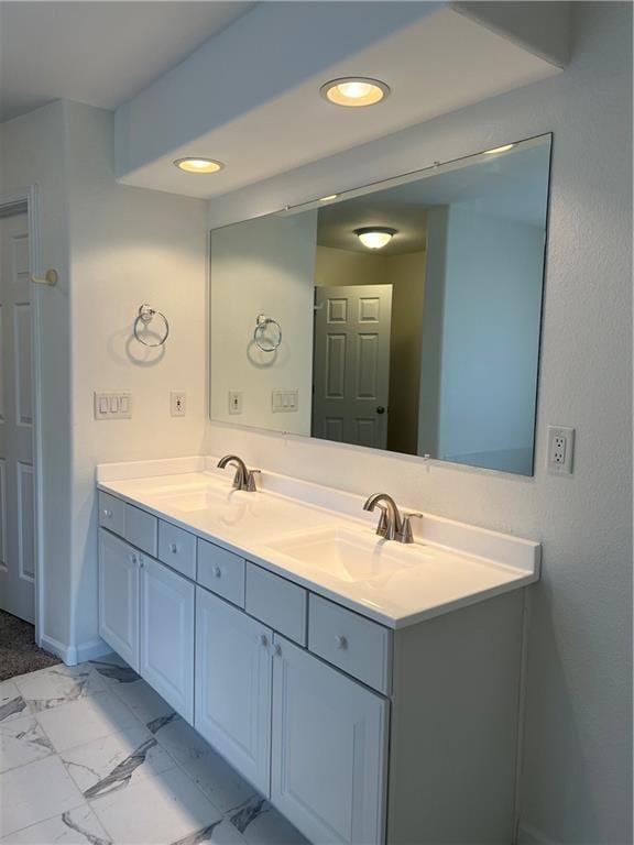 36987 W 63rd St, Camden, MO 64017 - bathroom with double vanity, marble finish flooring, and recessed lighting