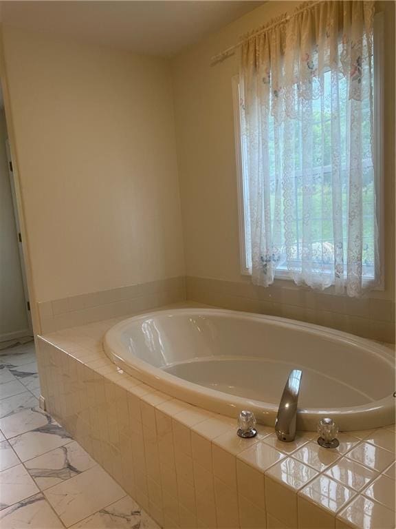 36987 W 63rd St, Camden, MO 64017 - bathroom with a garden tub and marble finish floors