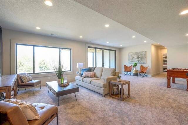 8020 Round Prairie St, Shawnee, KS 66220 - carpeted living area featuring a textured ceiling and recessed lighting