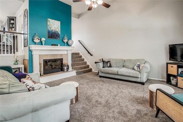 5323 Kenton St, Shawnee, KS 66226 - carpeted living room with ceiling fan, a tile fireplace, and stairs
