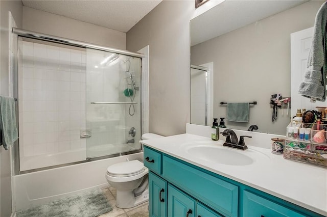 5323 Kenton St, Shawnee, KS 66226 - full bath with vanity, combined bath / shower with glass door, a textured ceiling, and tile patterned floors