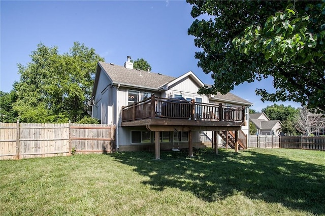 5323 Kenton St, Shawnee, KS 66226 - rear view of property featuring a wooden deck, stairway, a fenced backyard, and a chimney