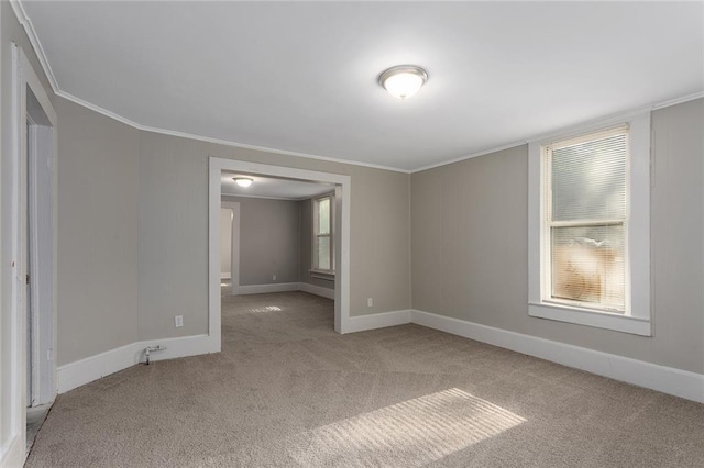 816 Chestnut St, Osawatomie, KS 66064 - spare room with carpet and ornamental molding