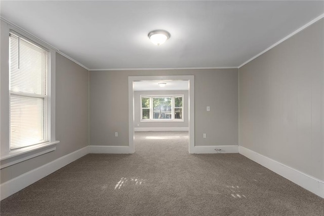 816 Chestnut St, Osawatomie, KS 66064 - carpeted empty room with crown molding