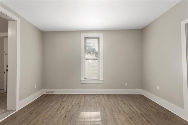 816 Chestnut St, Osawatomie, KS 66064 - unfurnished room with wood finished floors and baseboards