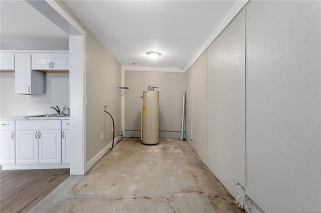 816 Chestnut St, Osawatomie, KS 66064 - below grade area featuring water heater and a sink