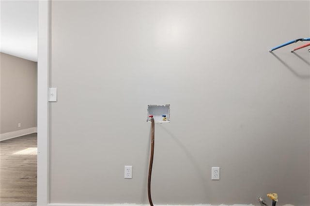 816 Chestnut St, Osawatomie, KS 66064 - laundry room featuring washer hookup and wood finished floors