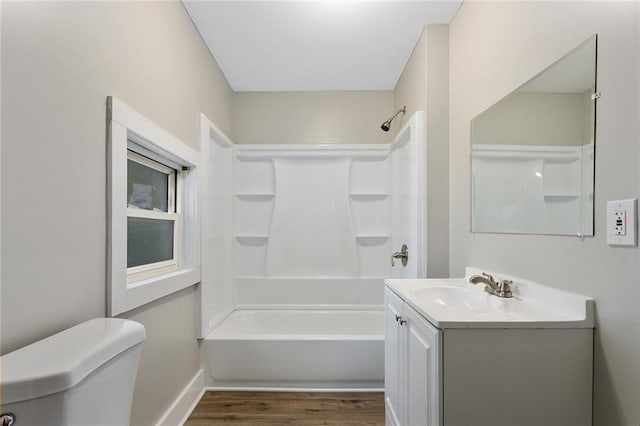 816 Chestnut St, Osawatomie, KS 66064 - bathroom with vanity, wood finished floors, and shower / bath combination