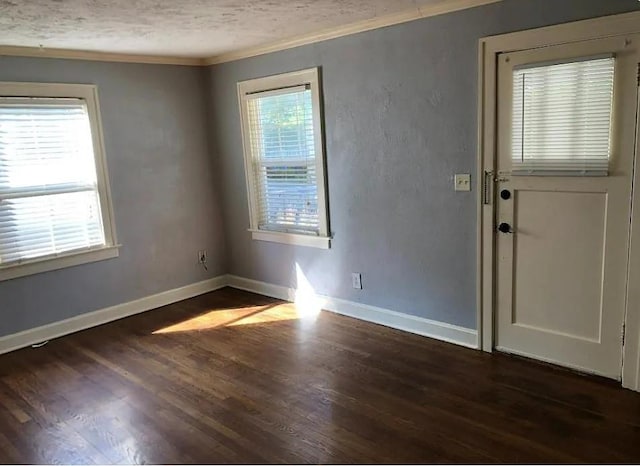 8007 Mercier St, Kansas City, MO 64114 - unfurnished room featuring ornamental molding, dark wood-type flooring, and a textured ceiling