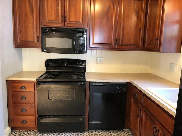 8007 Mercier St, Kansas City, MO 64114 - kitchen featuring black appliances and light countertops