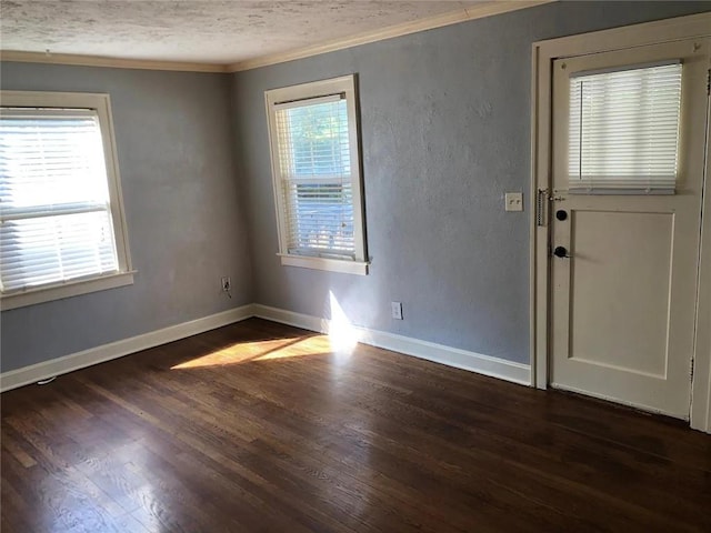 8007 Mercier St, Kansas City, MO 64114 - spare room featuring crown molding, dark wood finished floors, and a textured ceiling
