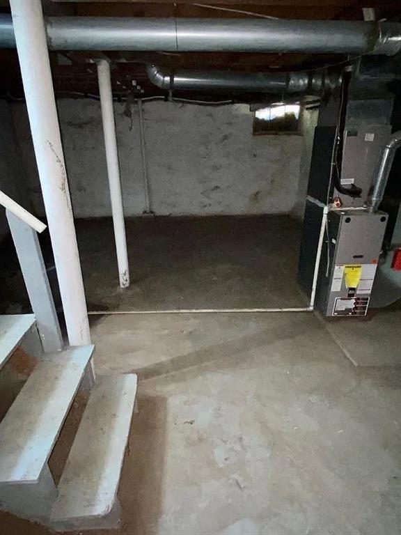 8007 Mercier St, Kansas City, MO 64114 - unfinished basement with heating unit