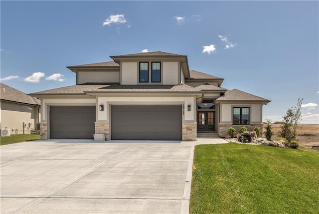 17521 Carter St, Overland Park, KS 66013 - prairie-style house with french doors, a front yard, stone siding, and stucco siding