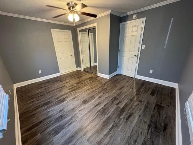 477 Shawnee Rd, Kansas City, KS 66103 - unfurnished bedroom featuring dark wood-style floors, ceiling fan, crown molding, and a closet