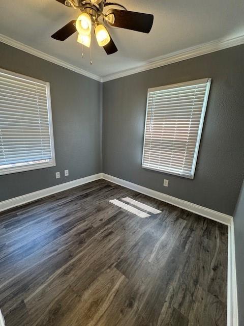477 Shawnee Rd, Kansas City, KS 66103 - unfurnished room featuring dark wood-style floors, crown molding, and a ceiling fan