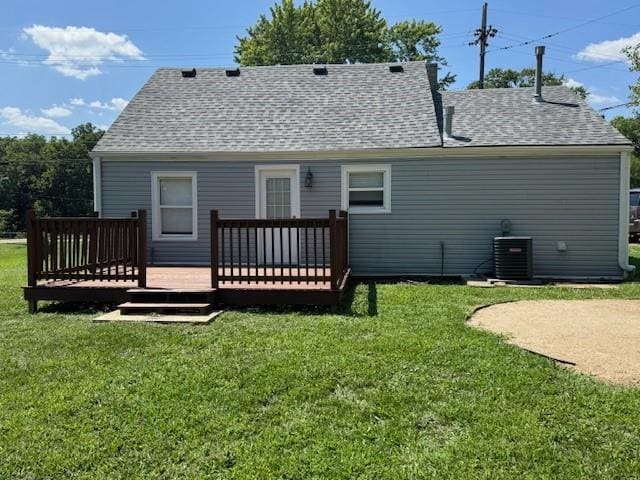 477 Shawnee Rd, Kansas City, KS 66103 - back of property with a deck, a lawn, and a shingled roof