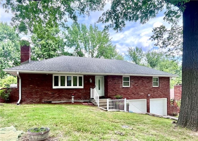 11510 Ridge Dr, Sugar Creek, MO 64054 - single story home featuring a chimney, brick siding, a garage, a front lawn, and a shingled roof